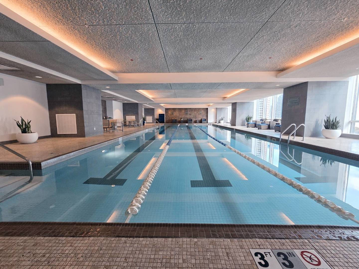 401 North Wabash Avenue, Unit 79C Chicago, IL 60611 - Photo 32 of 38 a room with lots of counter and windows