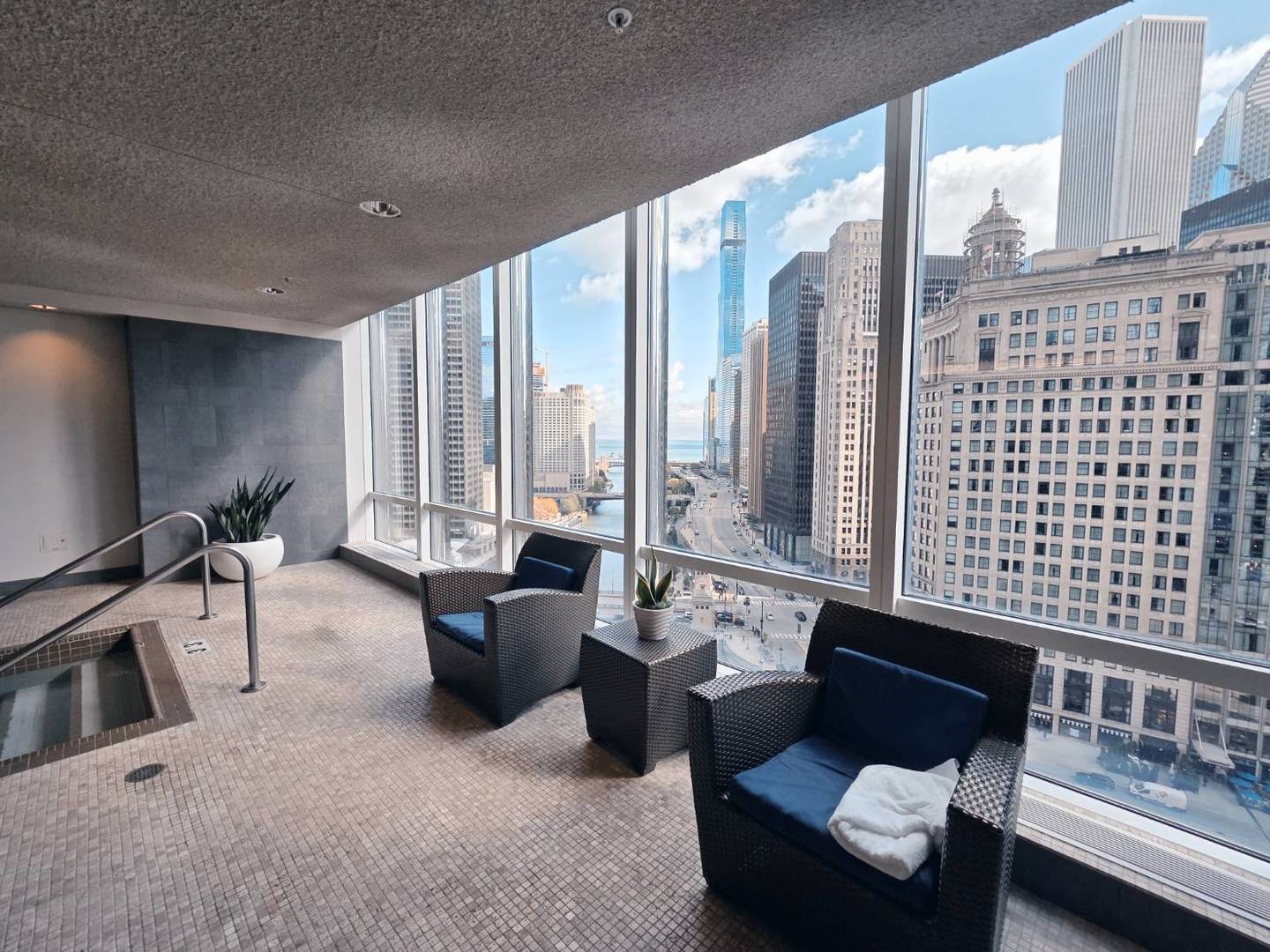 401 North Wabash Avenue, Unit 79C Chicago, IL 60611 - Photo 34 of 38 a living room with furniture and large windows