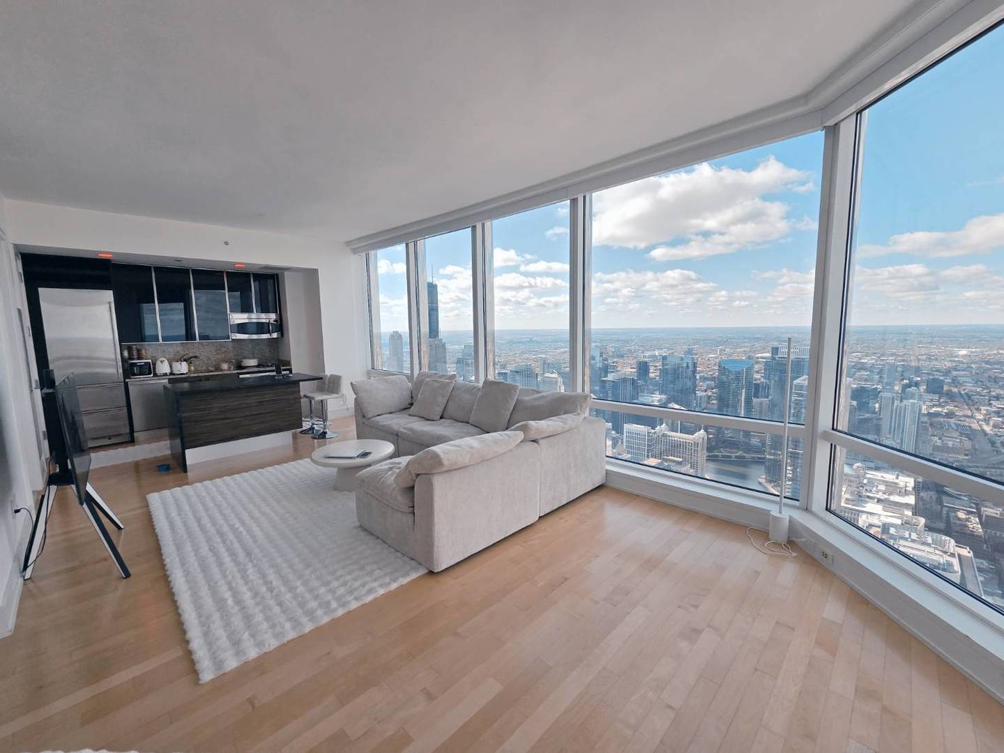 401 North Wabash Avenue, Unit 79C Chicago, IL 60611 - Photo 4 of 38 a living room with furniture and a large window
