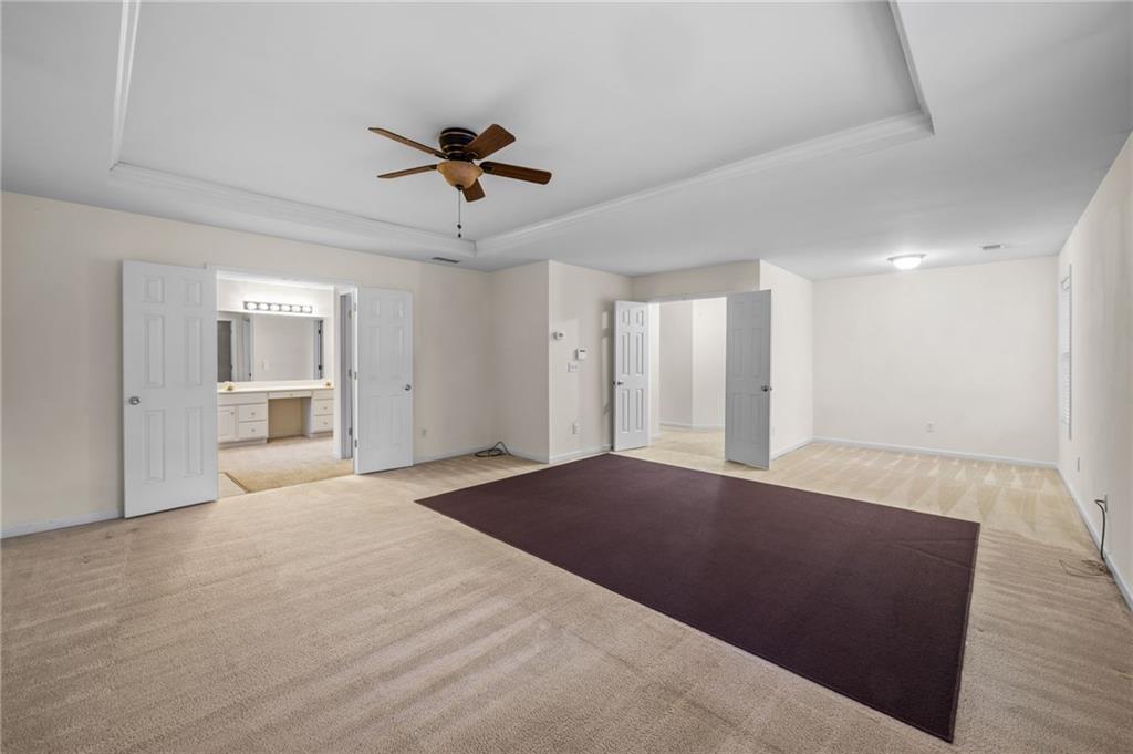 2935 Haynes Club Circle Southwest Grayson, GA 30017 - Photo 15 of 19 a view of an empty room with a window and a kitchen