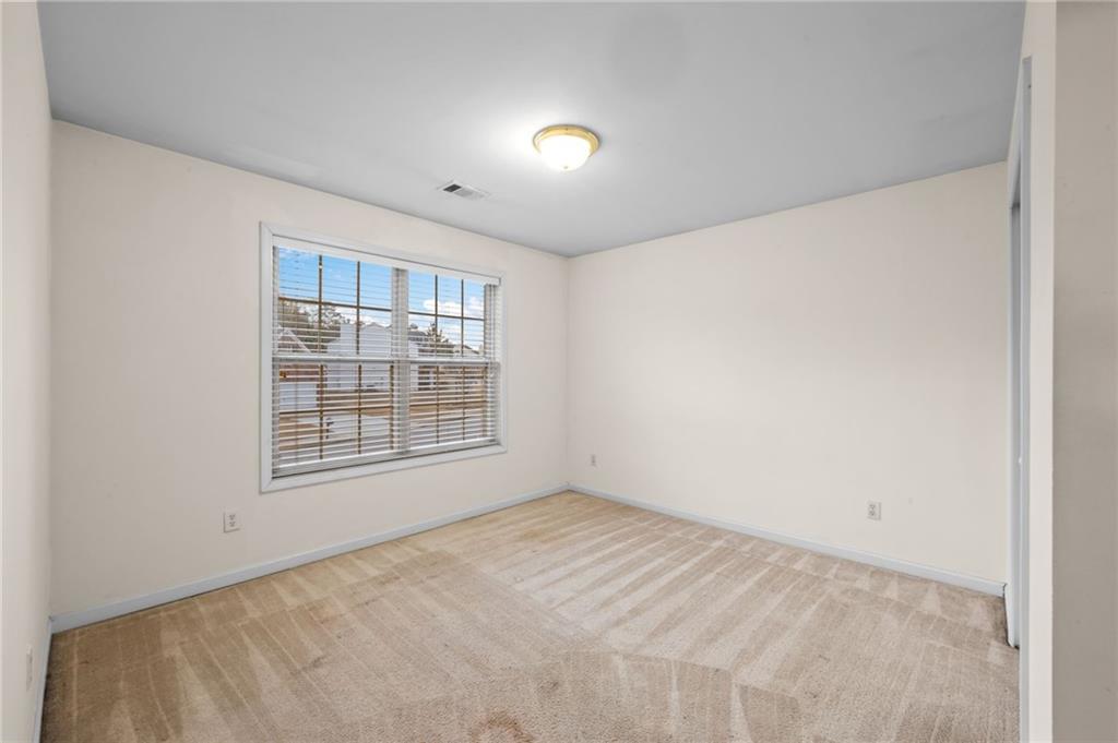 2935 Haynes Club Circle Southwest Grayson, GA 30017 - Photo 16 of 19 a view of an empty room with a window