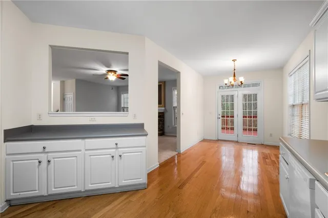 a view of a kitchen with cabinet and mirrors