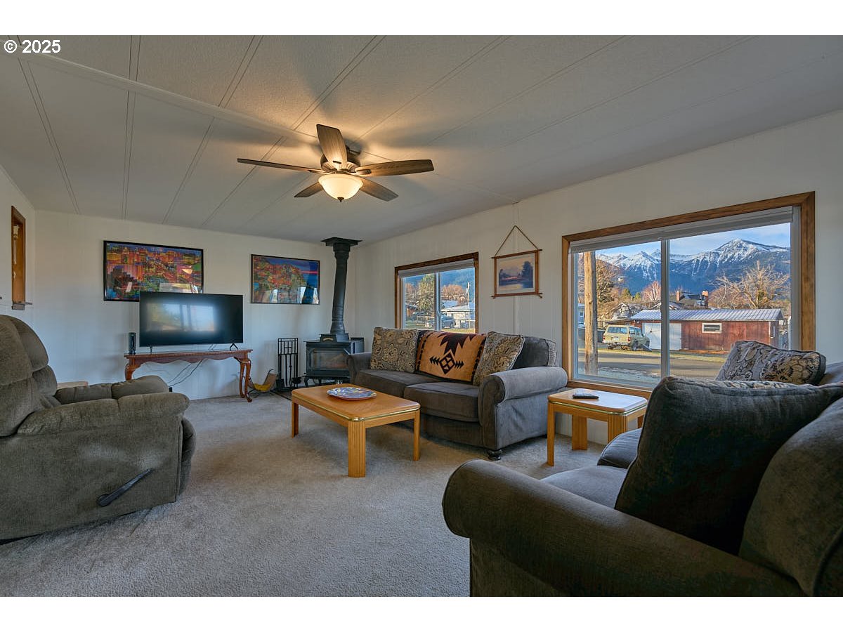502 South East Street Joseph, OR 97846 - Photo 3 of 21 a living room with furniture a large window and a flat screen tv