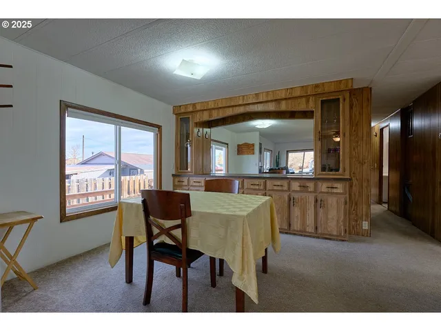 a view of a dining room with furniture and a livingroom