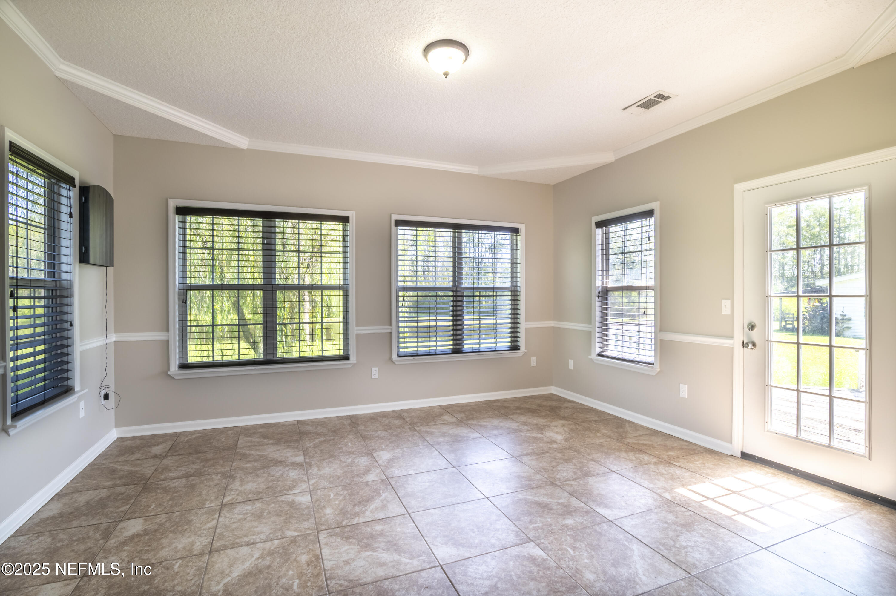 13561 Arnold Rhoden Road Glen St. Mary, FL 32040 - Photo 12 of 38 a view of an empty room with a window