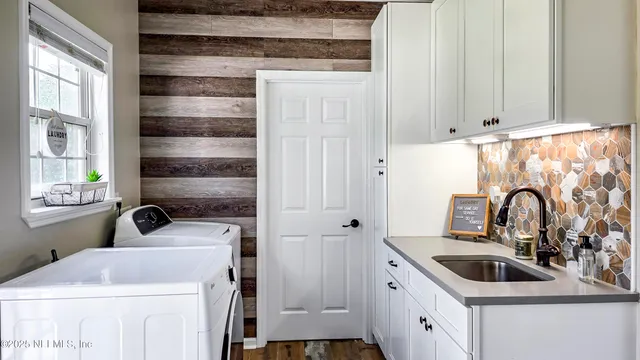 a bathroom with a sink and a window