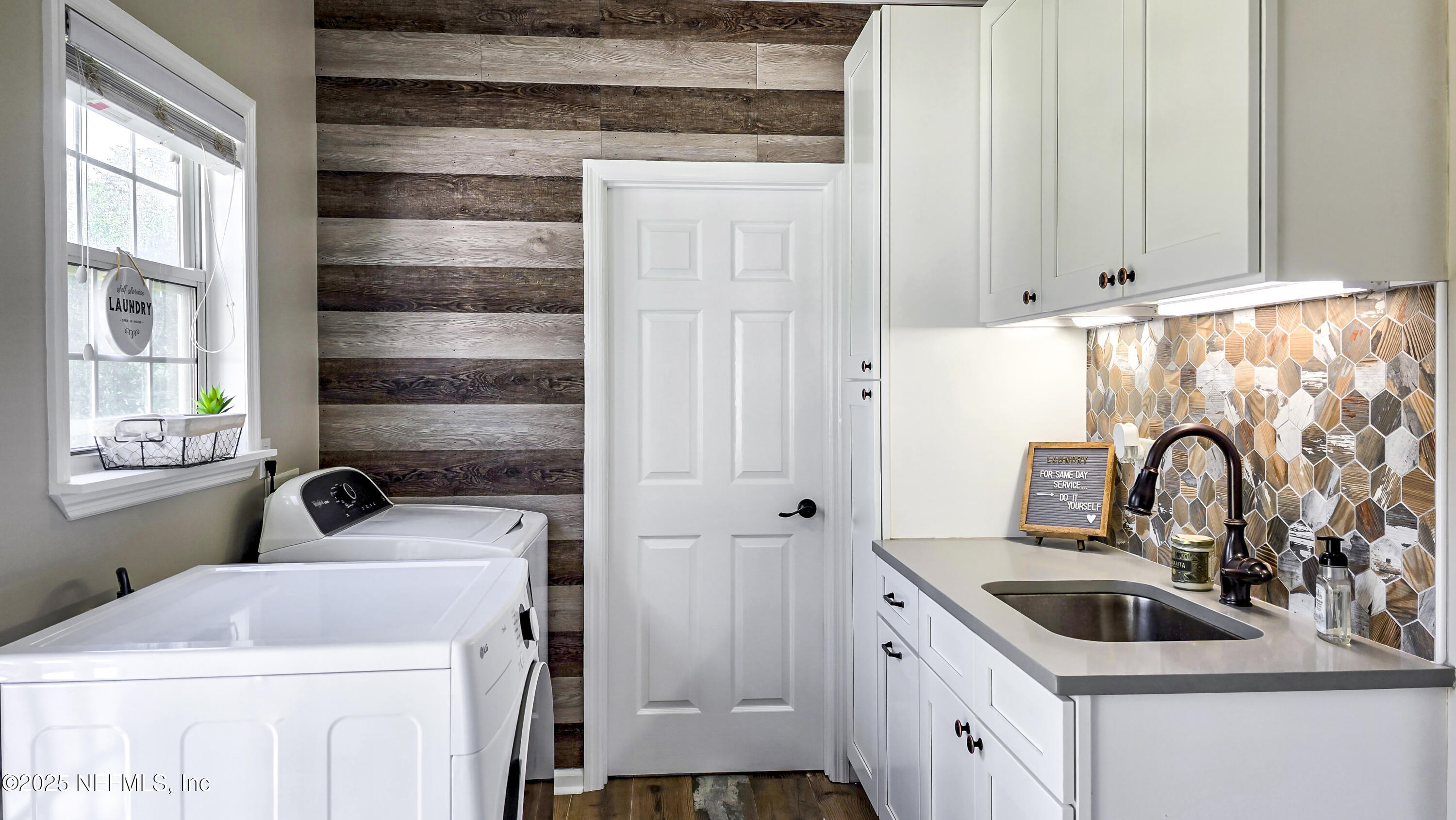 13561 Arnold Rhoden Road Glen St. Mary, FL 32040 - Photo 14 of 38 a bathroom with a sink and a window