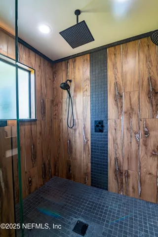 a kitchen with a sink stainless steel appliances and cabinets