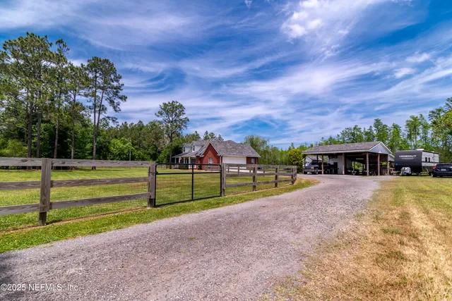 a view of house with backyard and entertaining space