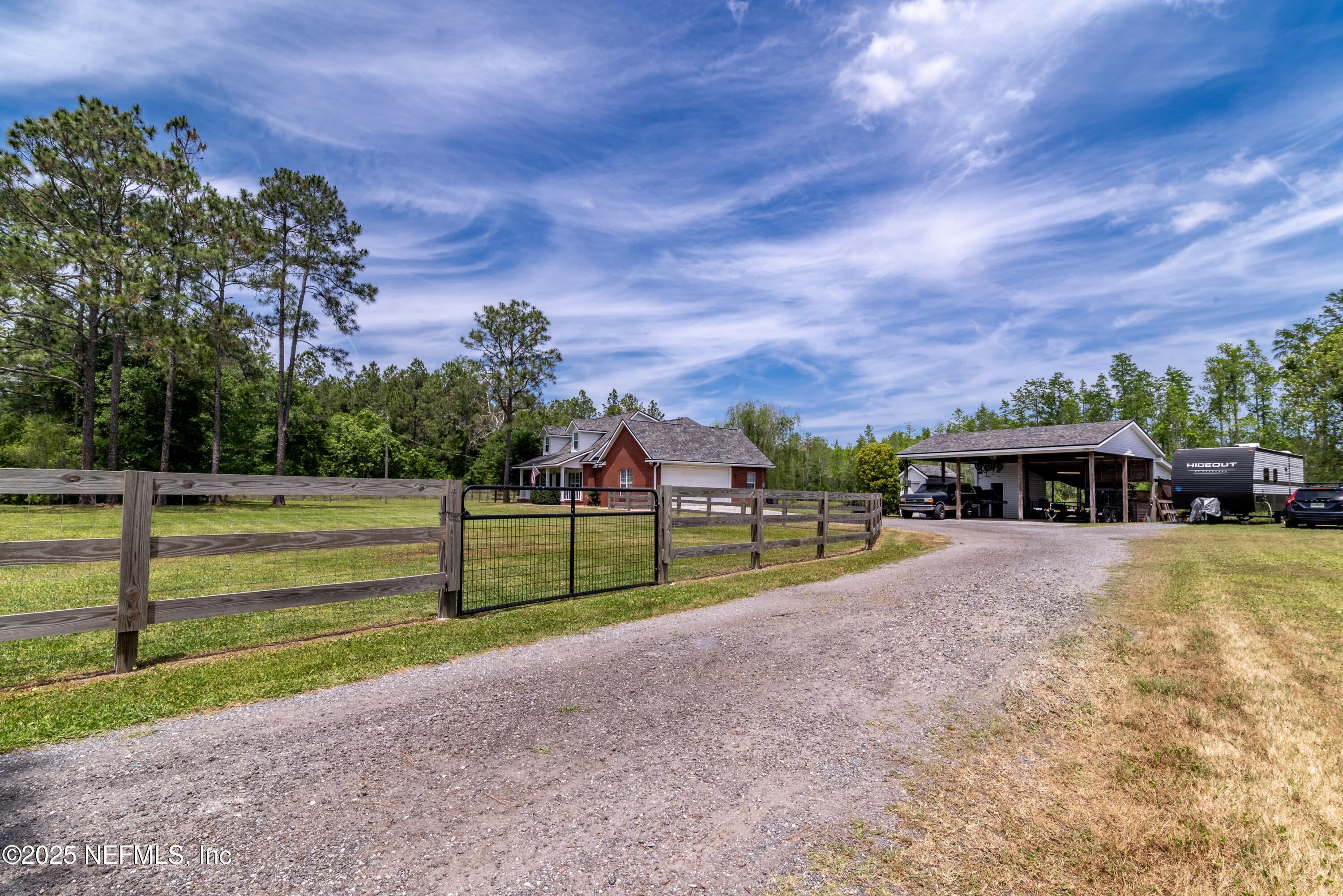 13561 Arnold Rhoden Road Glen St. Mary, FL 32040 - Photo 2 of 38 a view of house with backyard and entertaining space