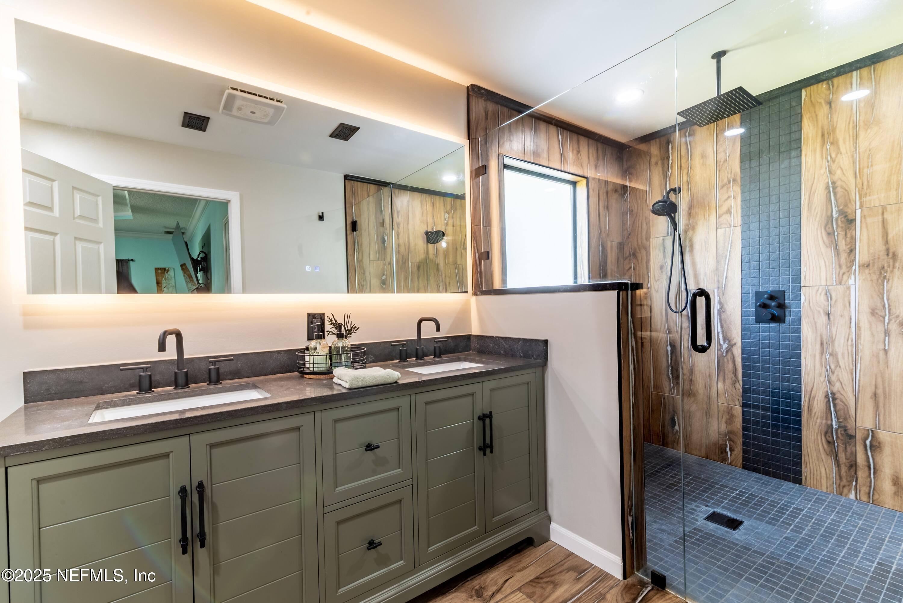 13561 Arnold Rhoden Road Glen St. Mary, FL 32040 - Photo 21 of 38 a bathroom with a granite countertop sink mirror and double