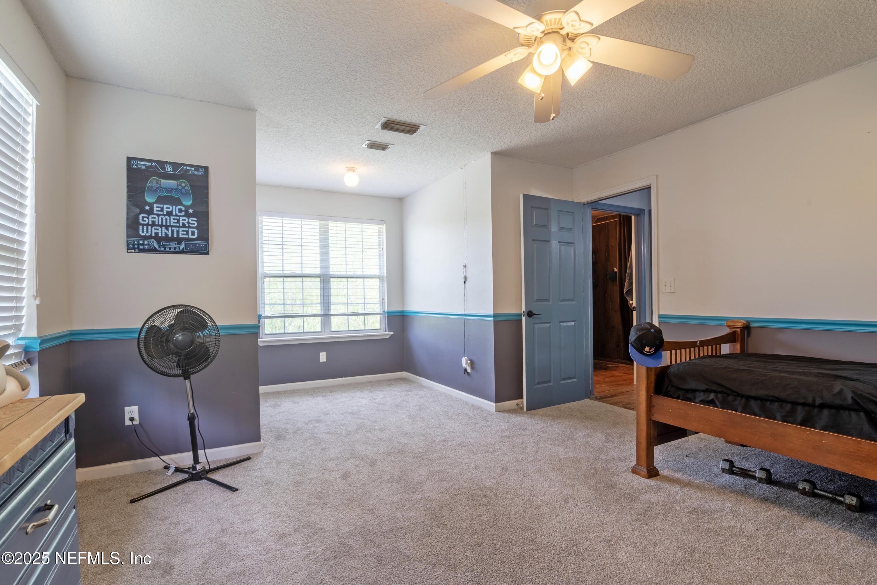 13561 Arnold Rhoden Road Glen St. Mary, FL 32040 - Photo 23 of 38 a view of workspace with window and ceiling fan