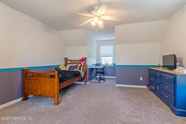 a view of a house with backyard and porch