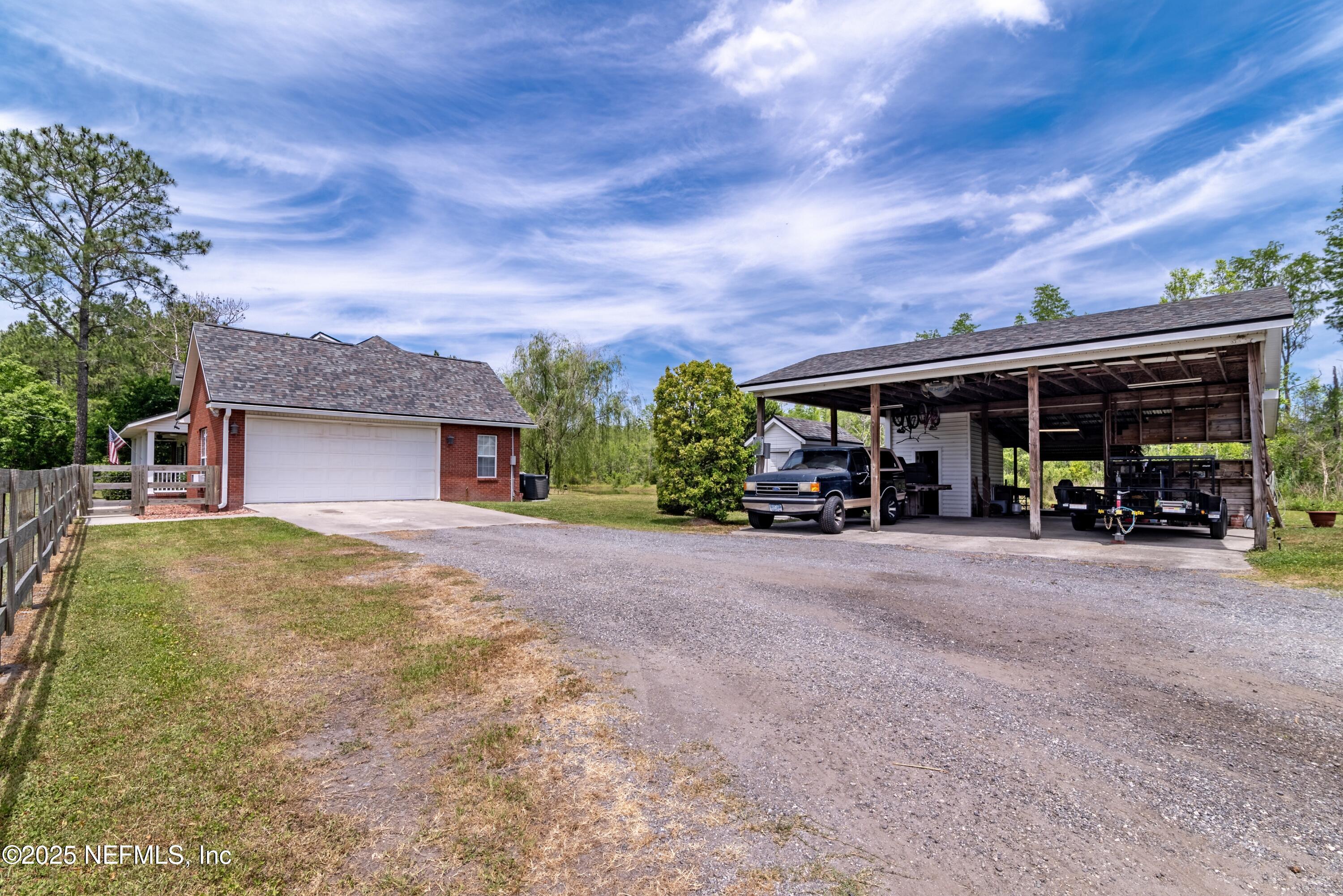13561 Arnold Rhoden Road Glen St. Mary, FL 32040 - Photo 28 of 38 a view of a house with backyard and porch
