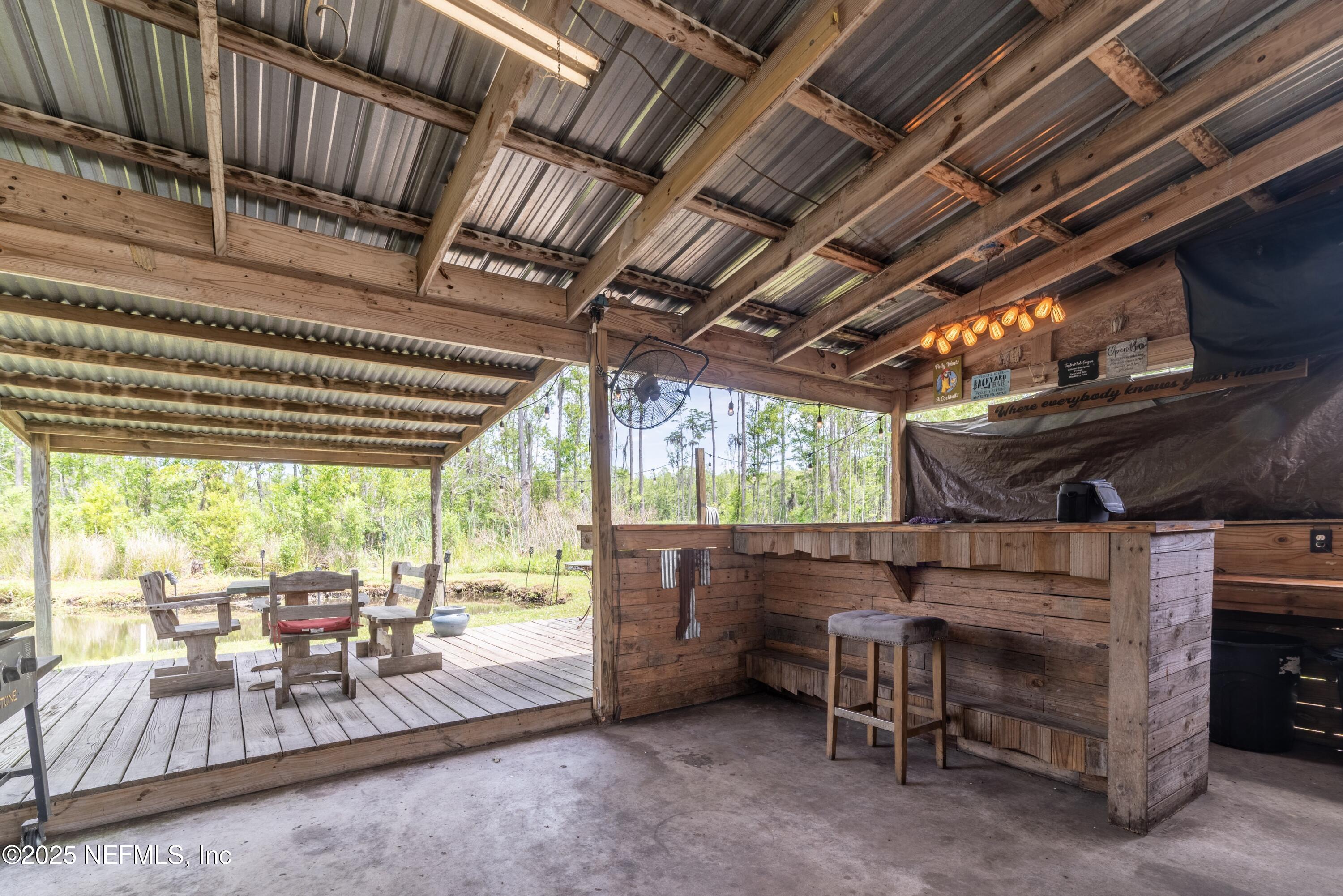 13561 Arnold Rhoden Road Glen St. Mary, FL 32040 - Photo 30 of 38 a view of a room with wooden furniture and roof