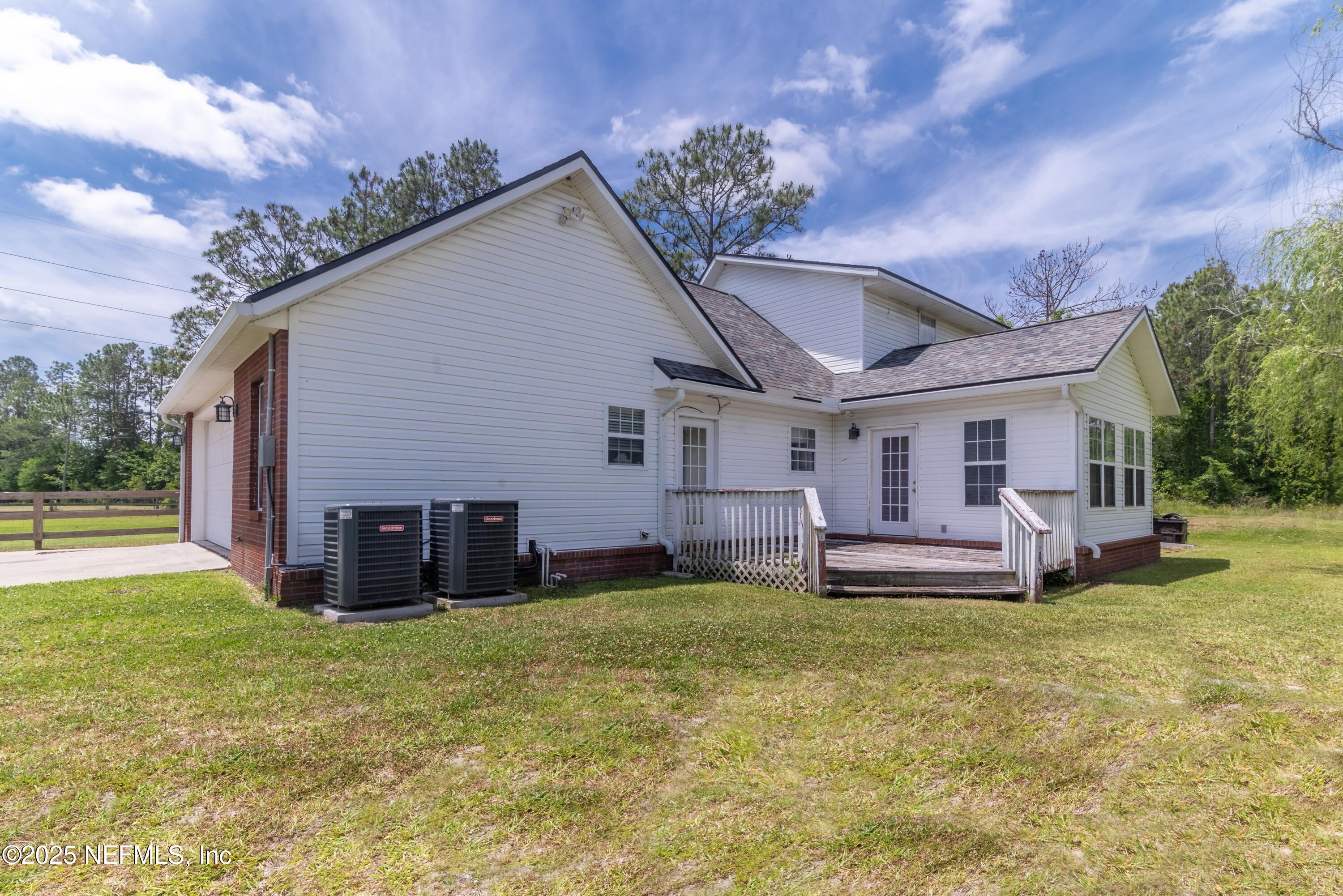 13561 Arnold Rhoden Road Glen St. Mary, FL 32040 - Photo 33 of 38 a view of a house with a yard and sitting area