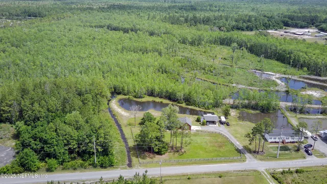 an aerial view of a house with outdoor space