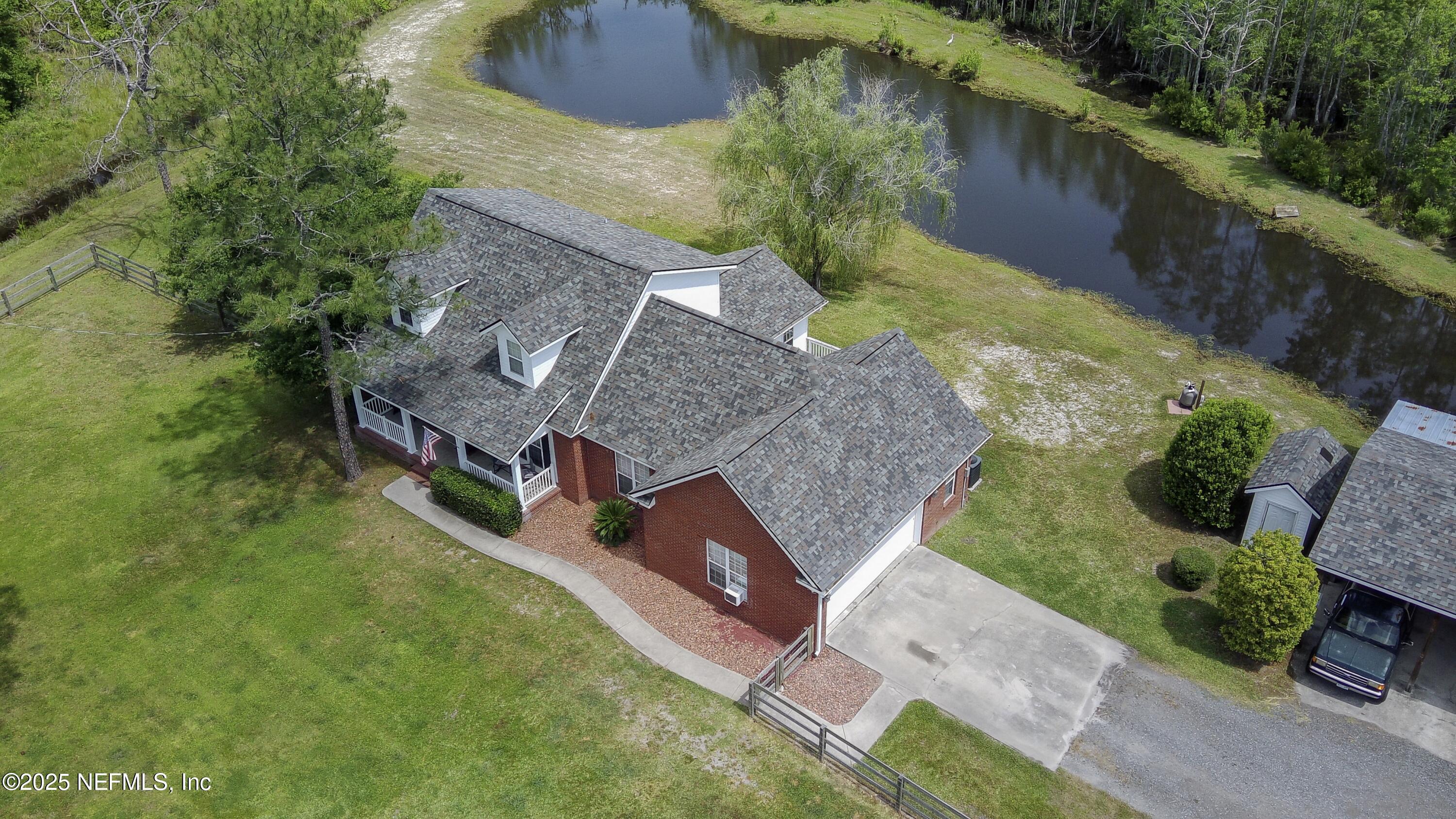 13561 Arnold Rhoden Road Glen St. Mary, FL 32040 - Photo 36 of 38 an aerial view of a house with a yard