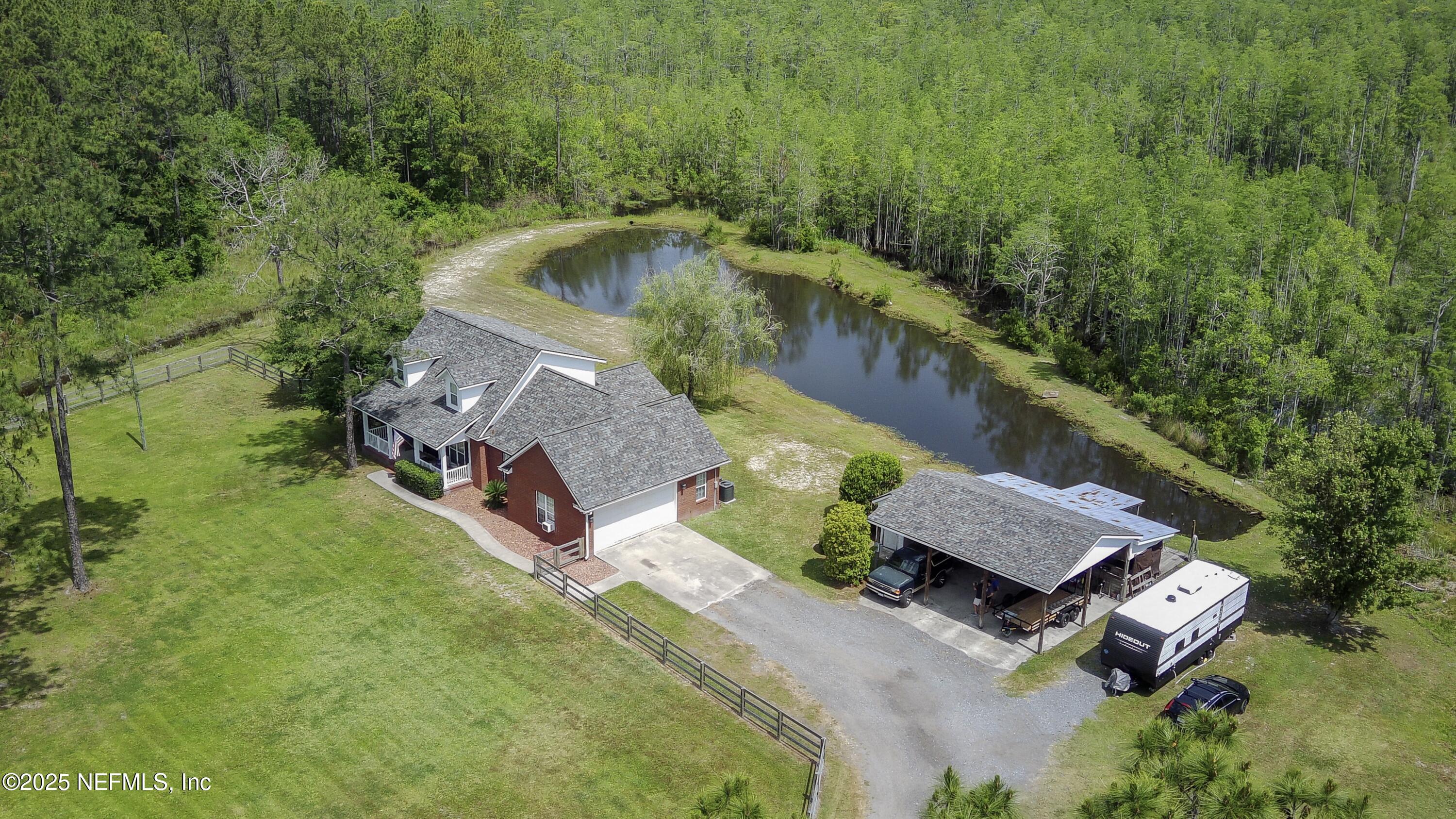 13561 Arnold Rhoden Road Glen St. Mary, FL 32040 - Photo 37 of 38 an aerial view of a house with outdoor space