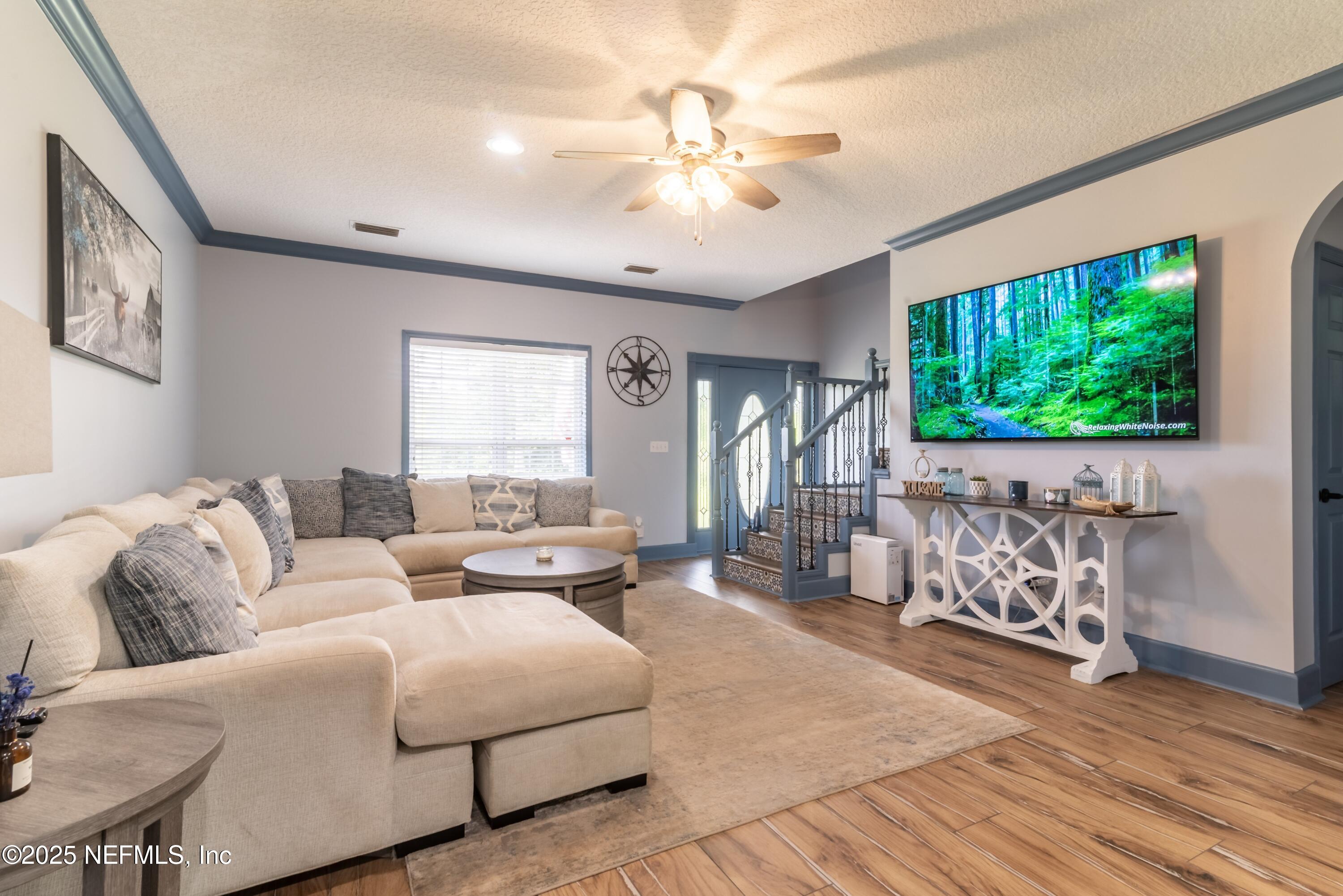 13561 Arnold Rhoden Road Glen St. Mary, FL 32040 - Photo 6 of 38 a living room with furniture and a flat screen tv