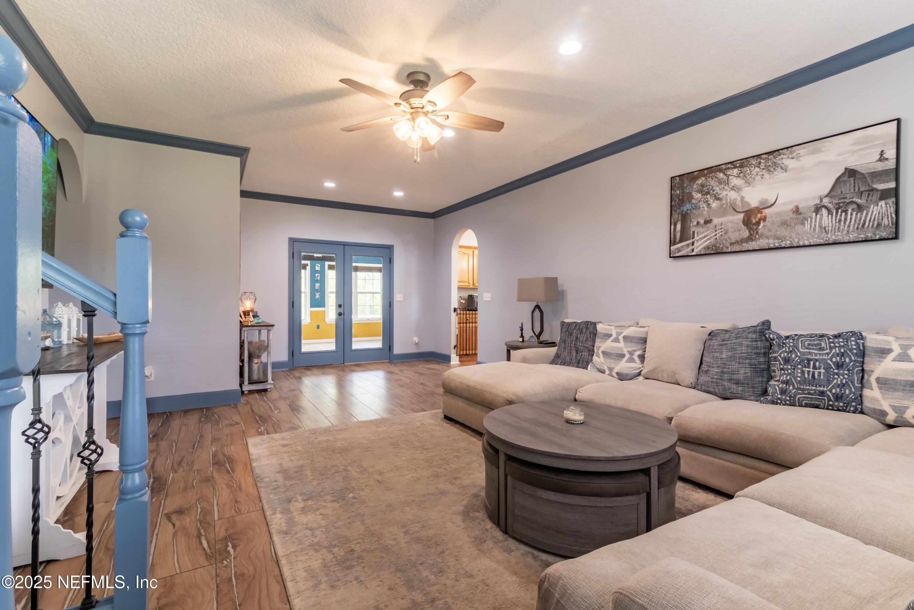 13561 Arnold Rhoden Road Glen St. Mary, FL 32040 - Photo 7 of 38 a living room with furniture and chandelier