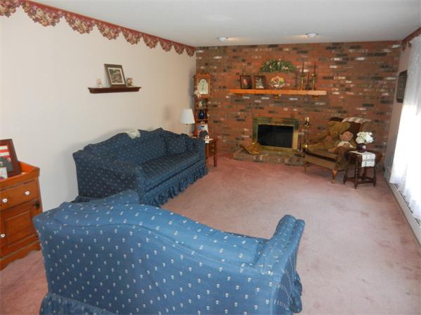 25 Sagamore Road West Springfield, MA 01089 - Photo 11 of 30 a living room with furniture a fireplace and a flat screen tv