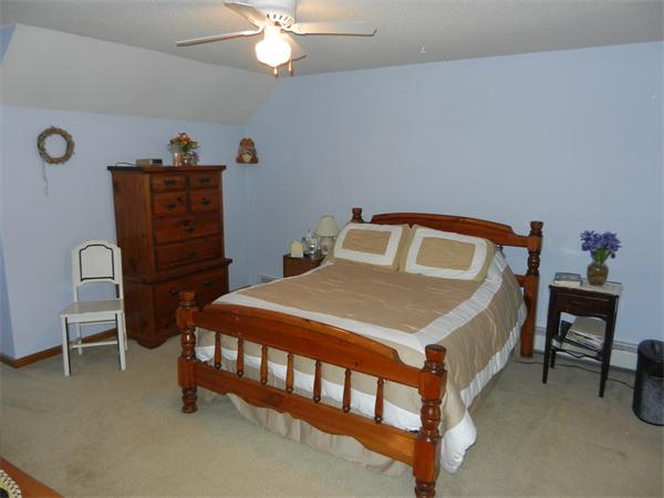 25 Sagamore Road West Springfield, MA 01089 - Photo 16 of 30 a bedroom with a bed and a table in it