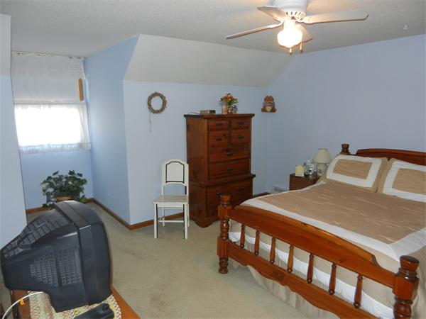 25 Sagamore Road West Springfield, MA 01089 - Photo 17 of 30 a bedroom with a bed and a chandelier