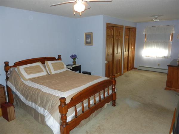 25 Sagamore Road West Springfield, MA 01089 - Photo 18 of 30 a bedroom with a bed and a chandelier