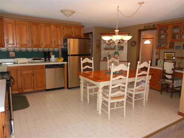 25 Sagamore Road West Springfield, MA 01089 - Photo 3 of 30 a dining table chair wooden floor and kitchen view