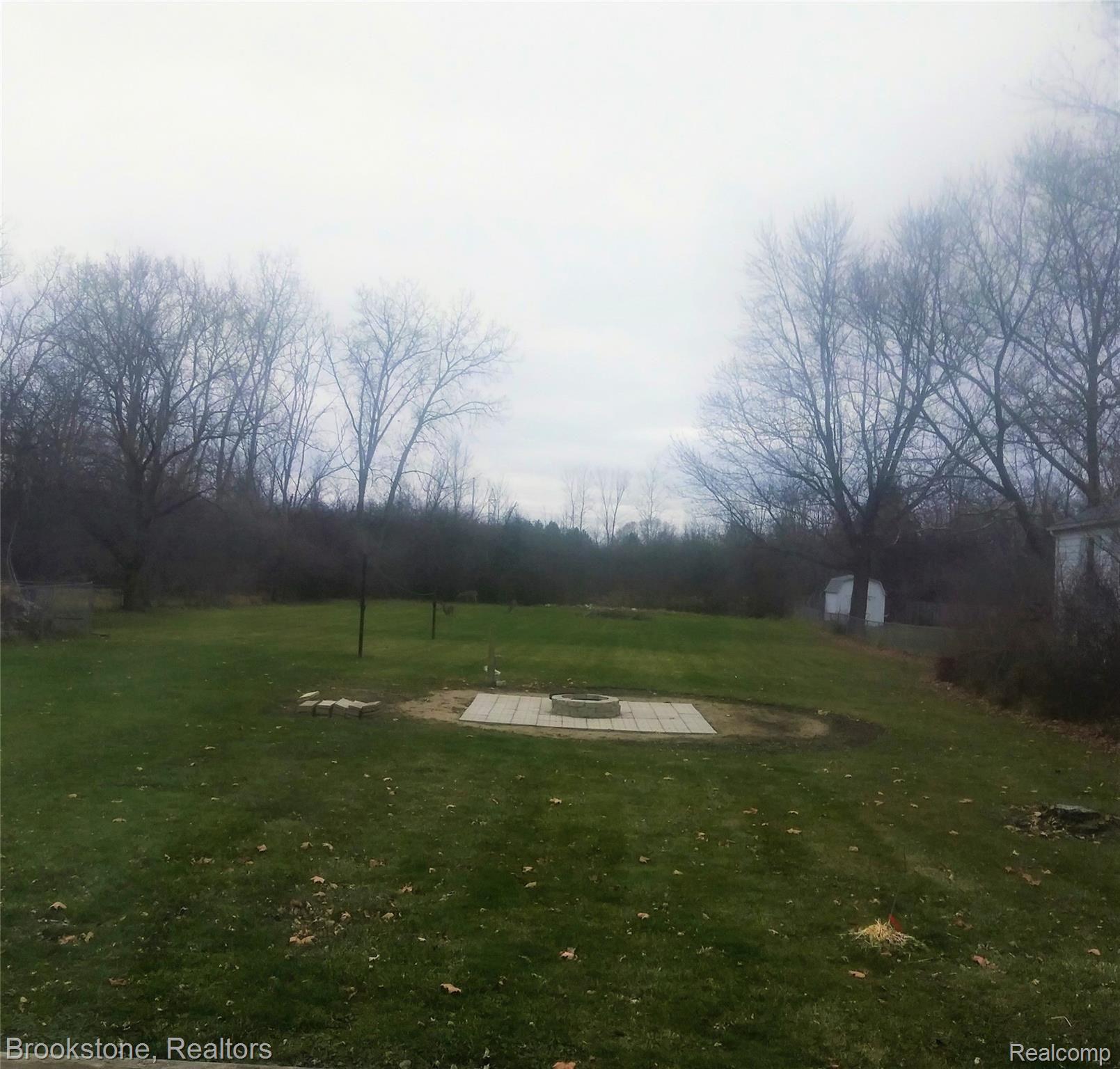 2156 Howe Road Burton, MI 48519 - Photo 33 of 33 Fire pit.jpg