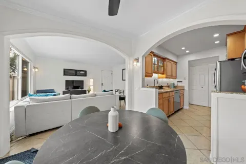 a kitchen with stainless steel appliances granite countertop a sink dishwasher stove top oven and refrigerator