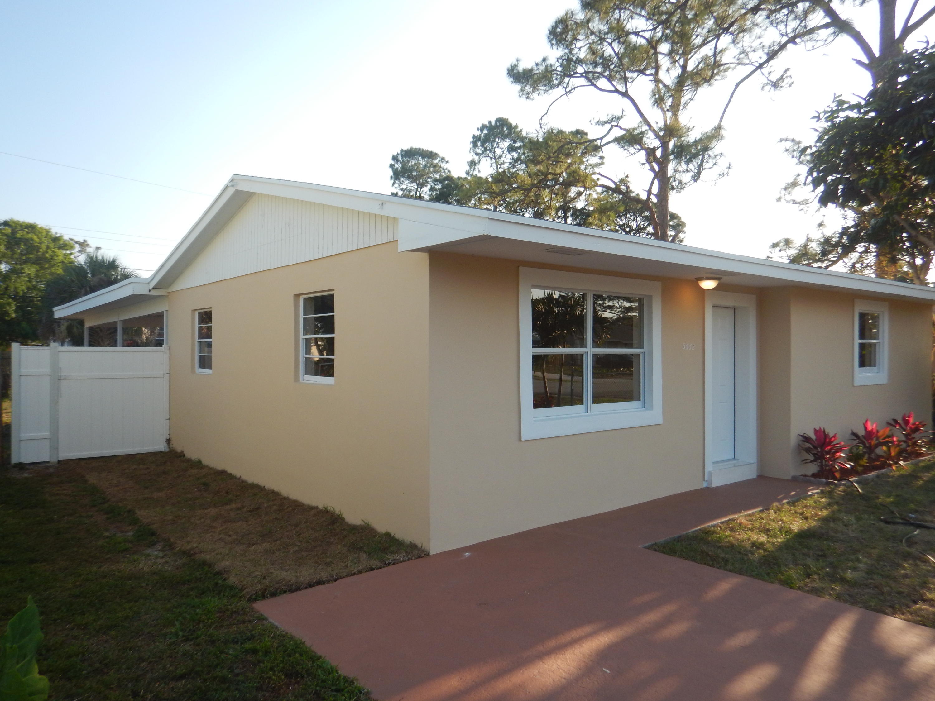 5662 Papaya Road West Palm Beach, FL 33413 - Photo 2 of 19 Side Home