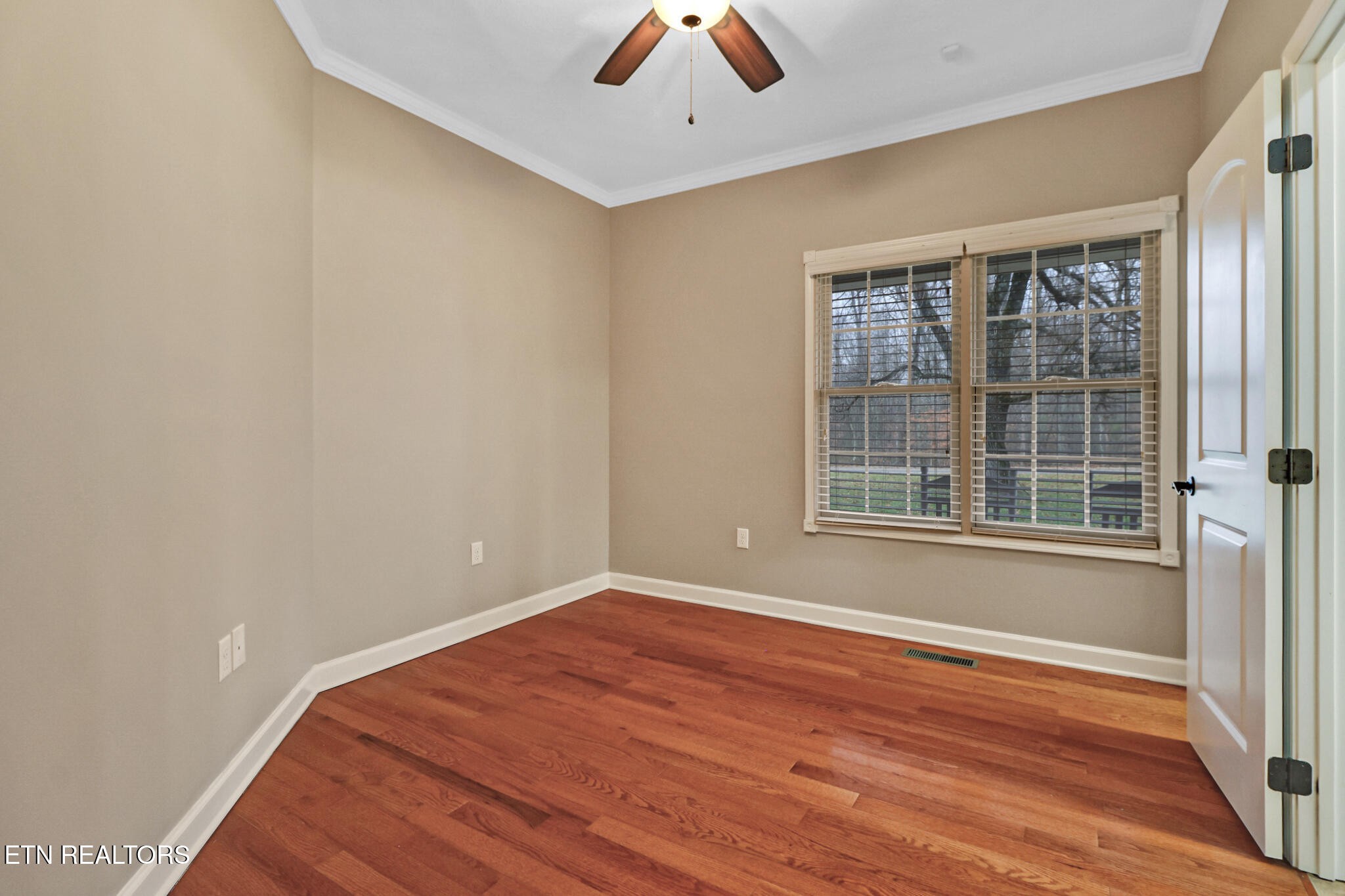 5424 Wilder Road Grimsley, TN 38565 - Photo 14 of 59 a view of an empty room with wooden floor and a window