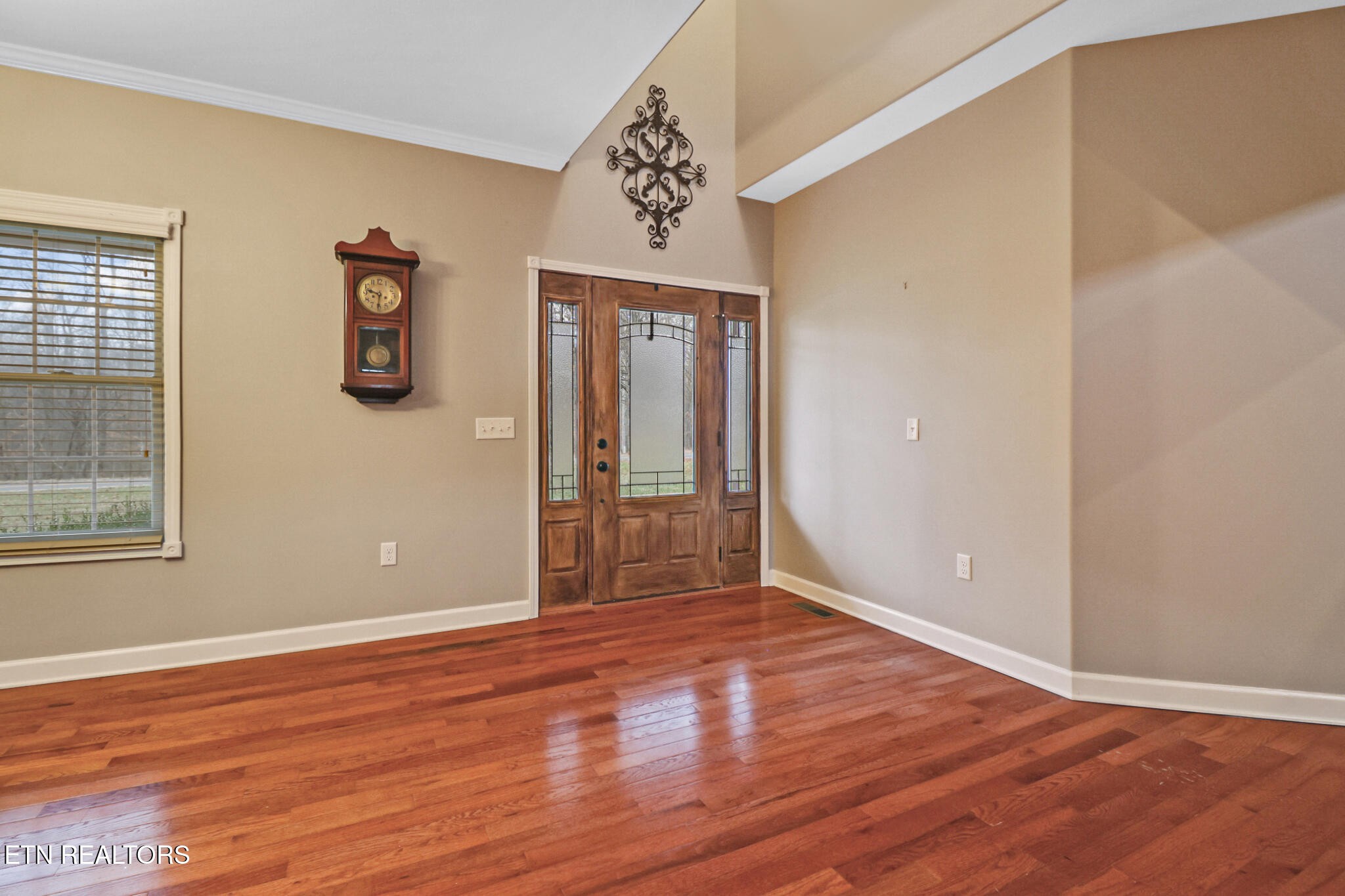 5424 Wilder Road Grimsley, TN 38565 - Photo 27 of 59 a view of an empty room with wooden floor and a window