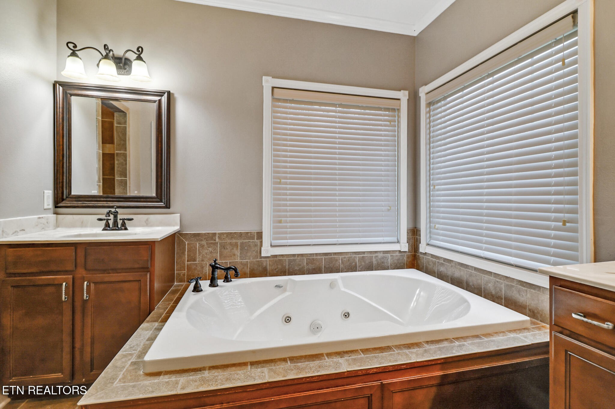 5424 Wilder Road Grimsley, TN 38565 - Photo 35 of 59 a bathroom with a bathtub sink and a mirror