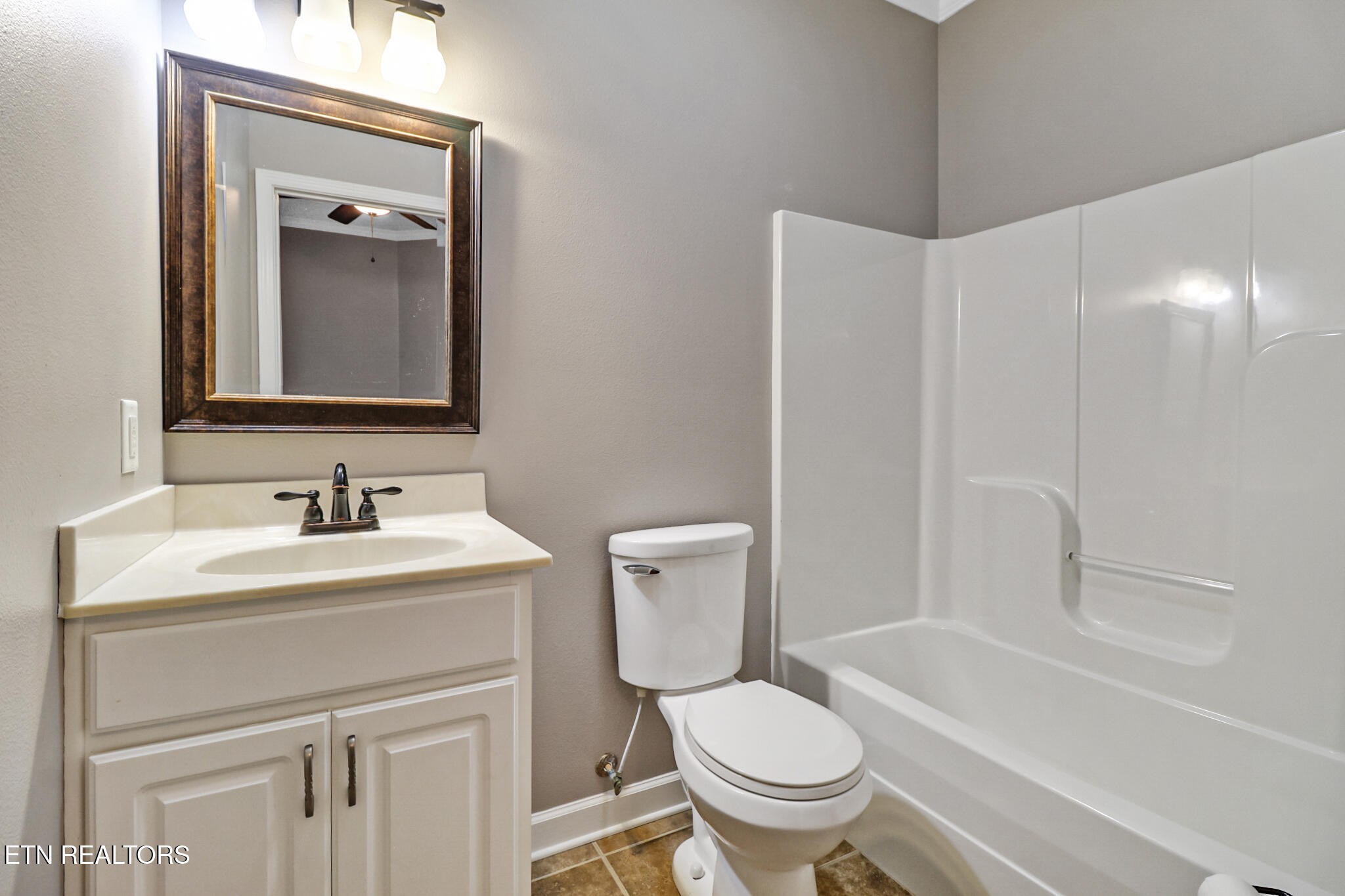 5424 Wilder Road Grimsley, TN 38565 - Photo 36 of 59 a bathroom with a toilet sink vanity tub and mirror
