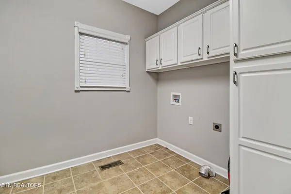a view of front door with hallway and stairs