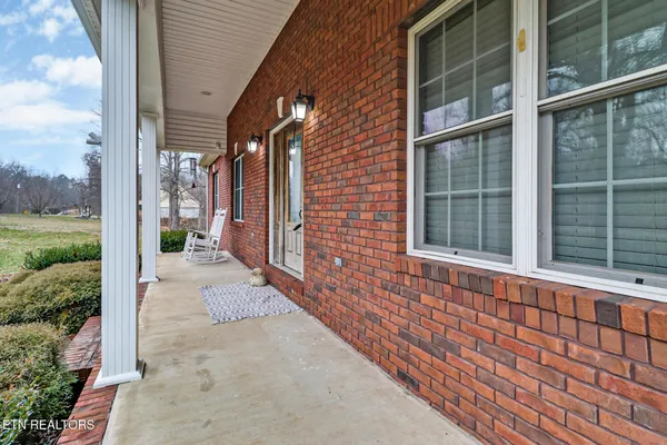 a view of a brick house with a large window