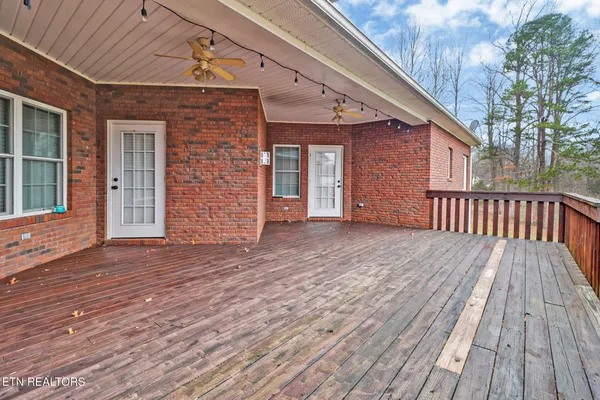 a view of a house with wooden deck