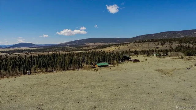 a view of a swimming pool with an outdoor seating