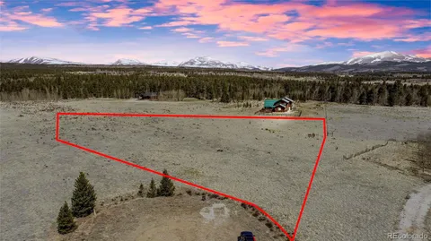 a view of a field with an outdoor space