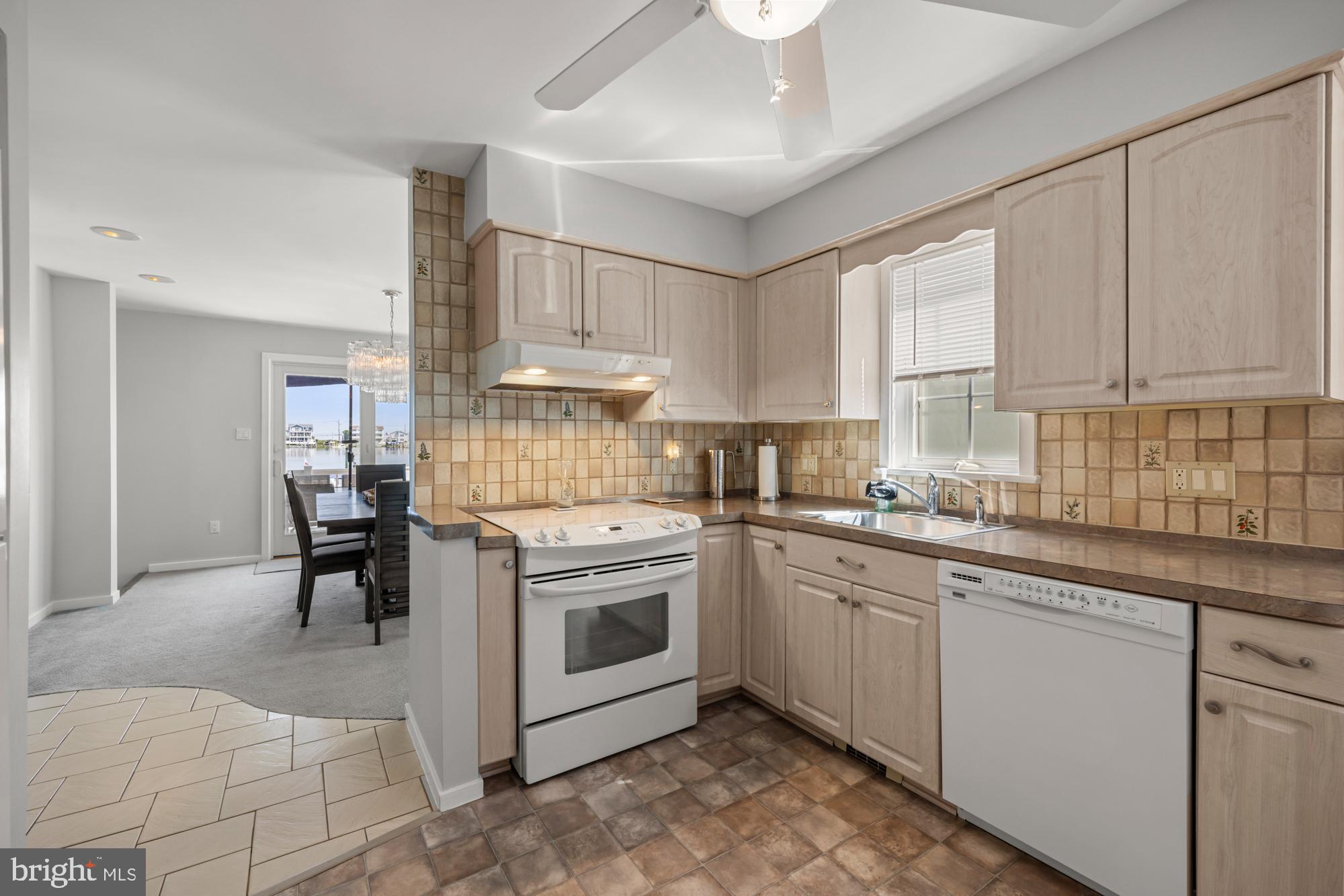 87 Lagoon Boulevard Brigantine, NJ 08203 - Photo 20 of 66 a kitchen with a sink cabinets and window