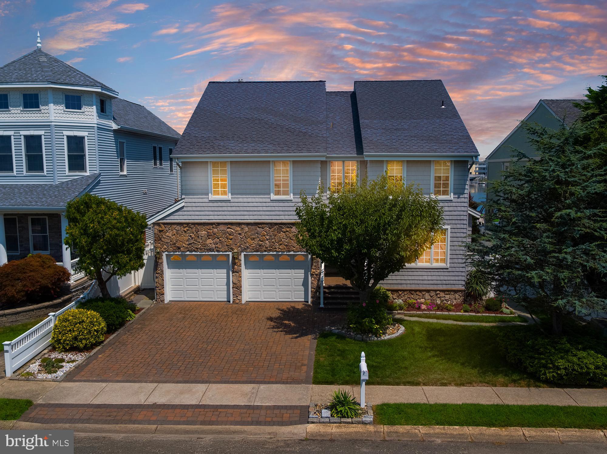 87 Lagoon Boulevard Brigantine, NJ 08203 - Photo 2 of 66 a front view of a house