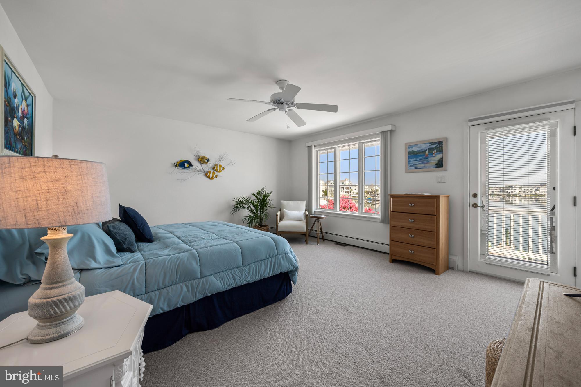 87 Lagoon Boulevard Brigantine, NJ 08203 - Photo 25 of 66 a living room with furniture and a chandelier