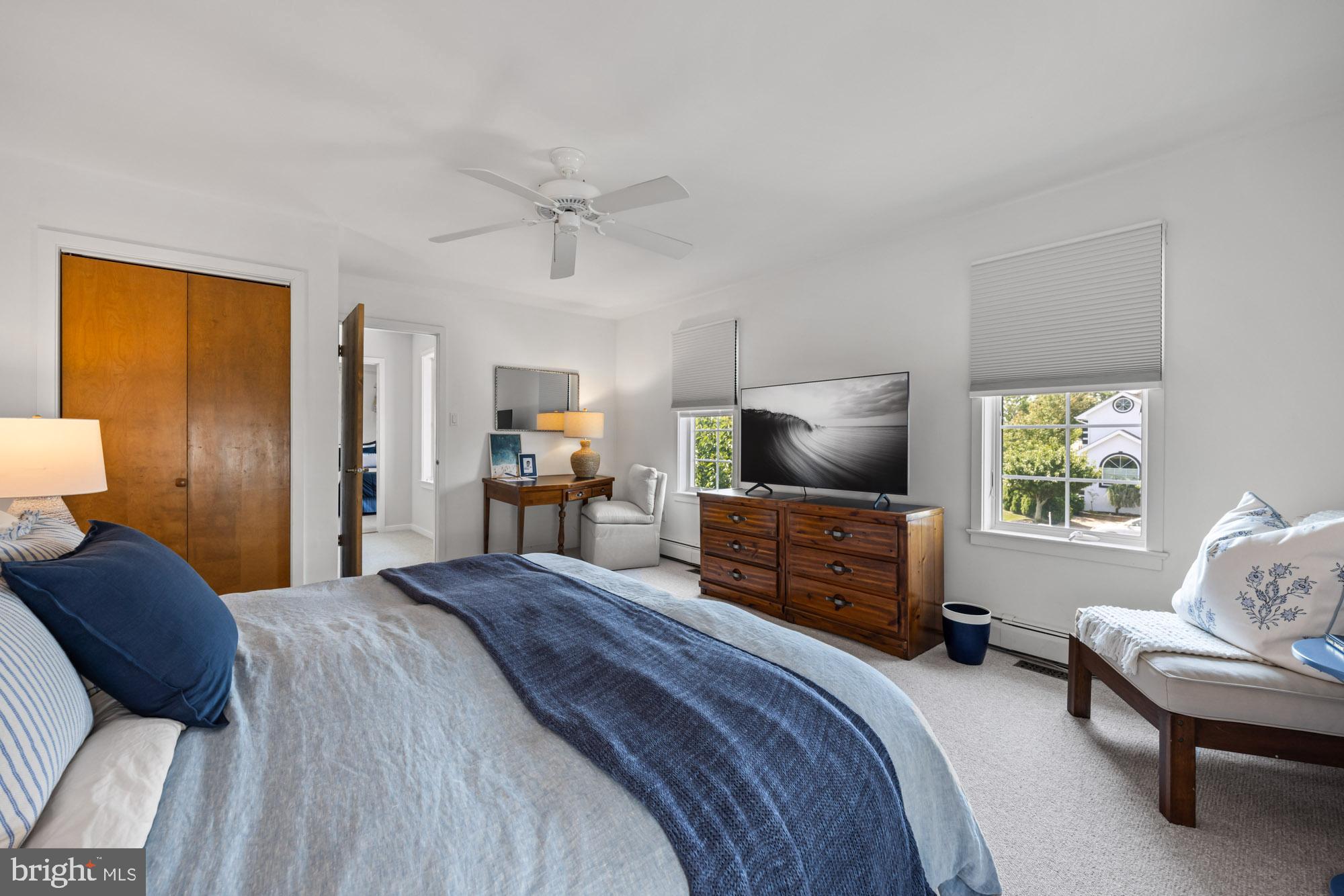 87 Lagoon Boulevard Brigantine, NJ 08203 - Photo 34 of 66 a bedroom with a bed and wooden floor