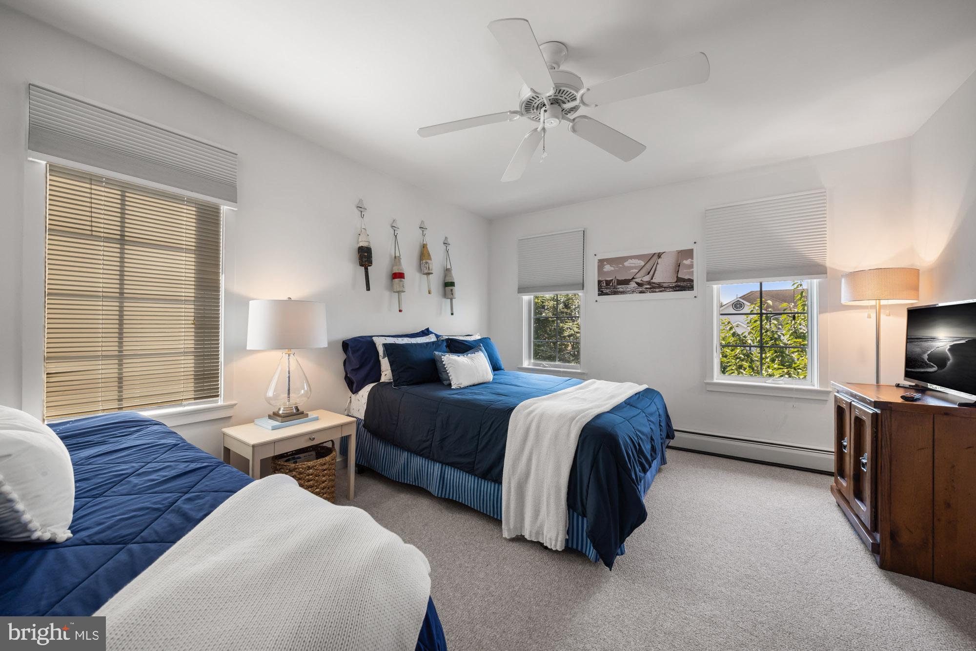 87 Lagoon Boulevard Brigantine, NJ 08203 - Photo 39 of 66 a bed room with bed and window