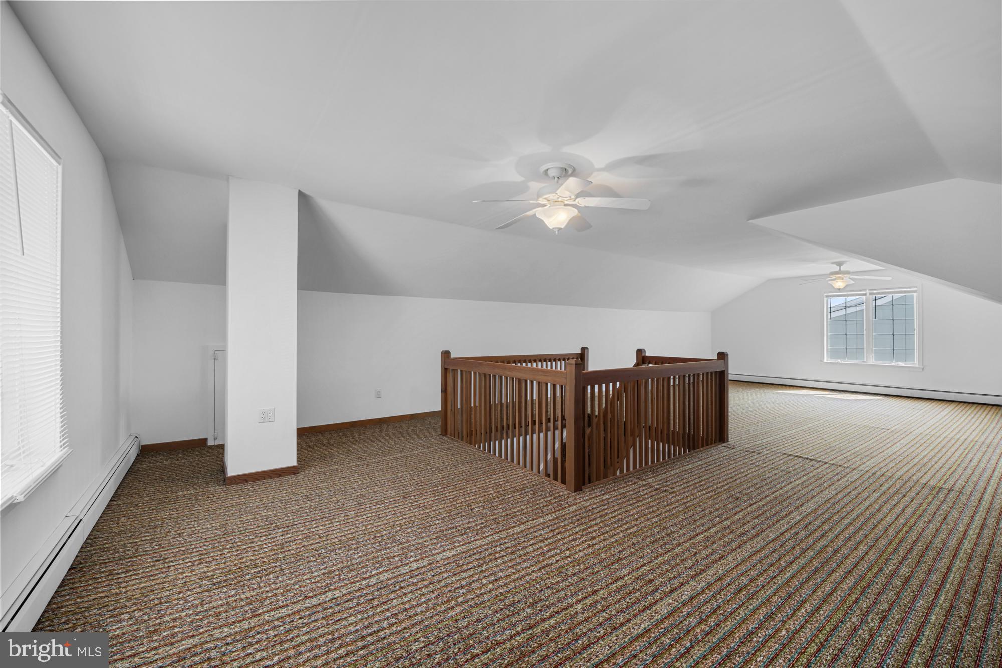 87 Lagoon Boulevard Brigantine, NJ 08203 - Photo 41 of 66 a view of a bedroom with furniture and window