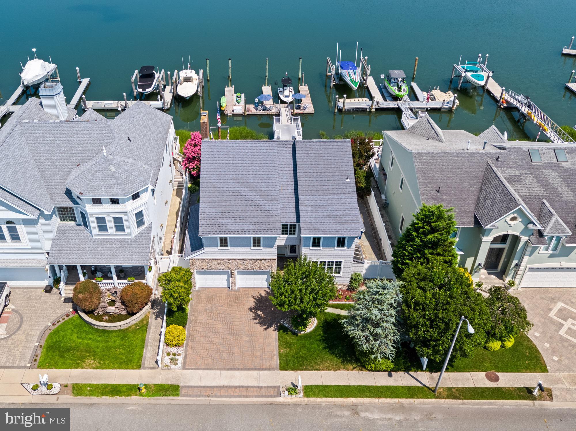87 Lagoon Boulevard Brigantine, NJ 08203 - Photo 5 of 66 an aerial view of multiple houses with outdoor space