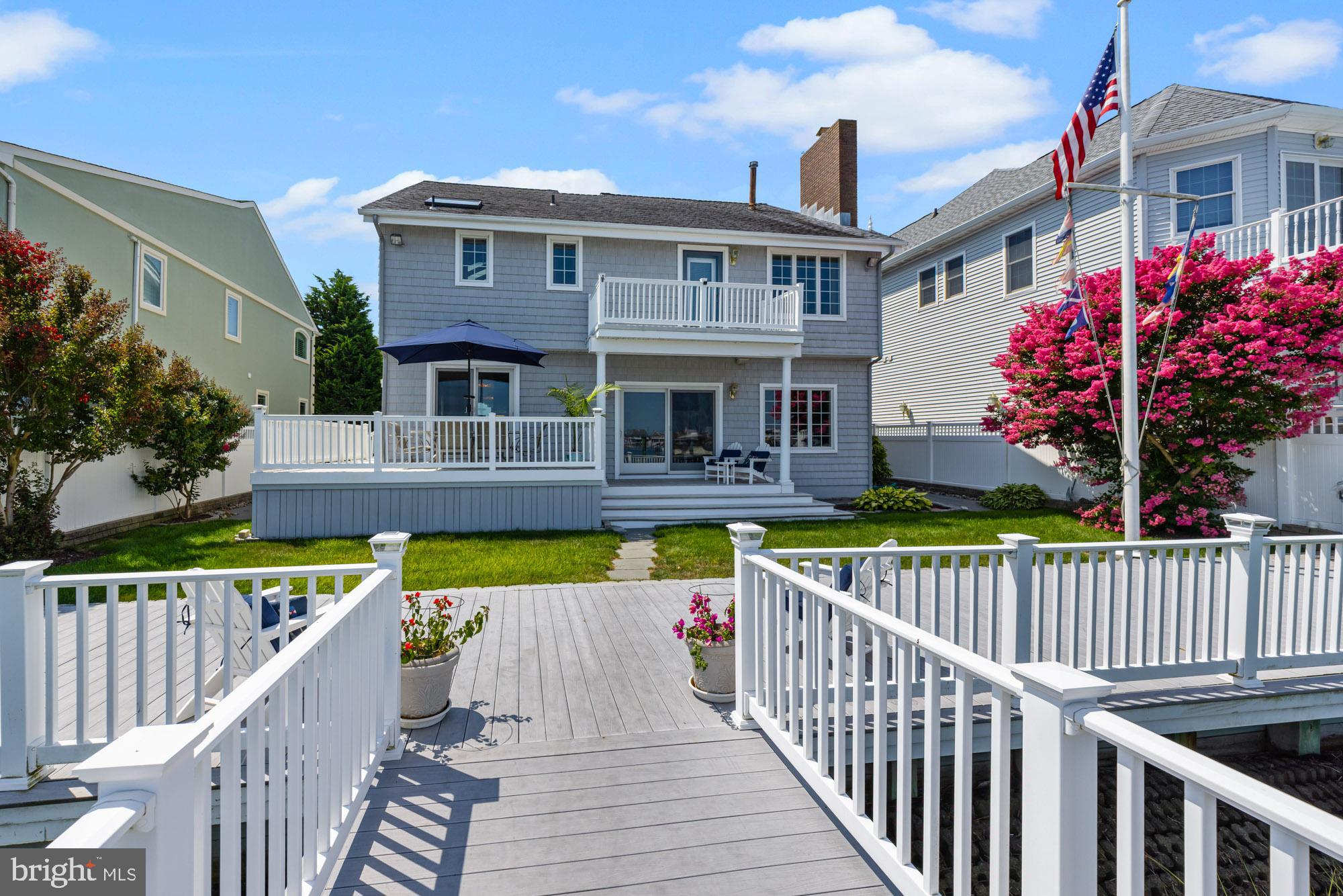 87 Lagoon Boulevard Brigantine, NJ 08203 - Photo 51 of 66 a view of a house with wooden deck
